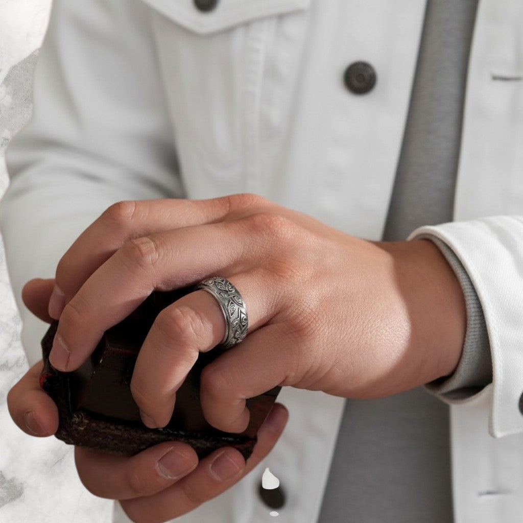 Championofgod Fear Not Ring, a silver band with intricate swirling patterns and eye-like motifs.