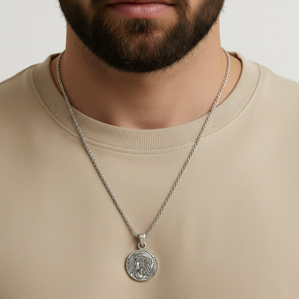 Championofgod King of Kings quarter necklace with Jesus profile on a silver chain worn by a man.