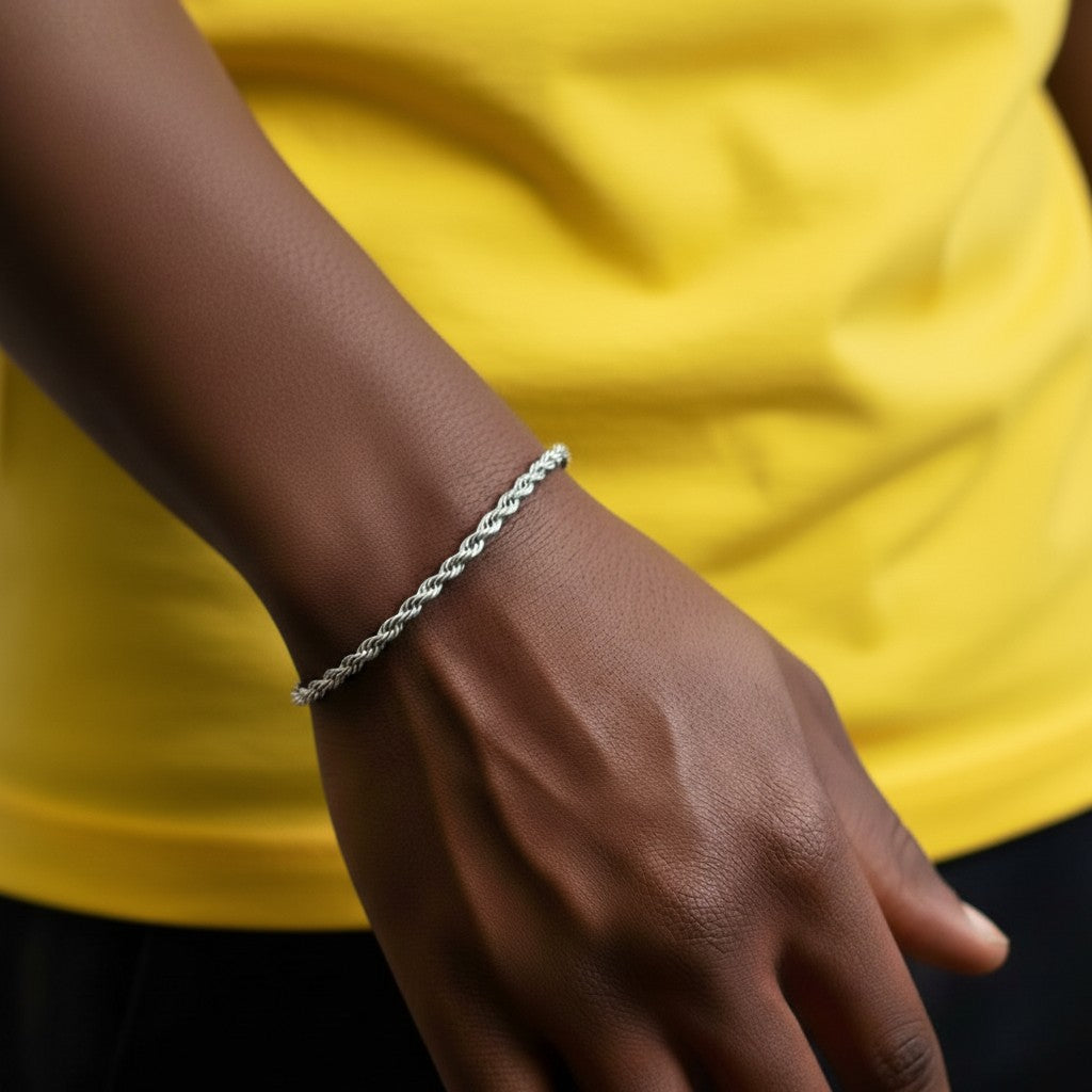 Championofgod silver 3mm rope bracelet worn on a wrist against a dark t-shirt.