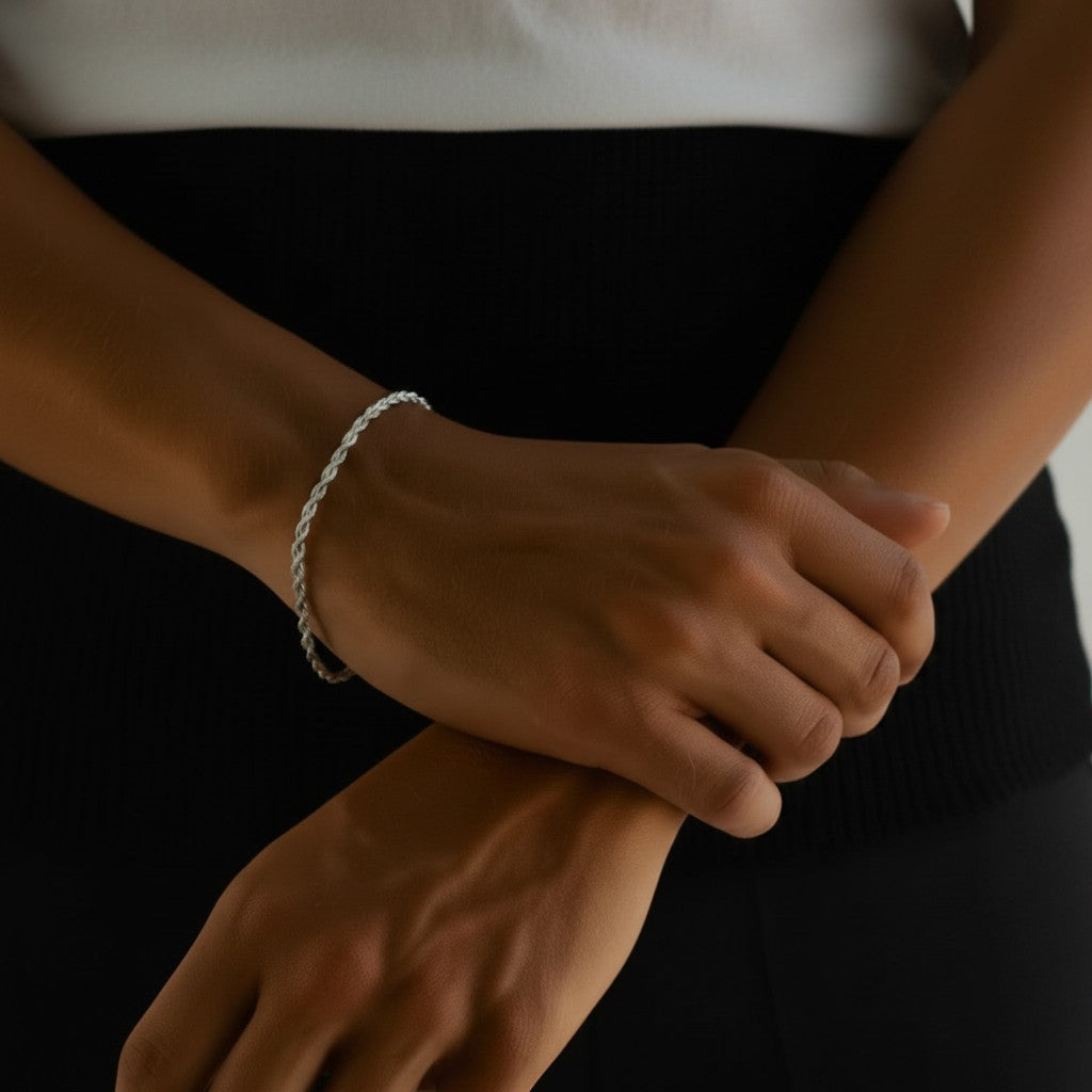Championofgod silver 3mm rope bracelet on a model's wrist. The bracelet has a twisted rope design.